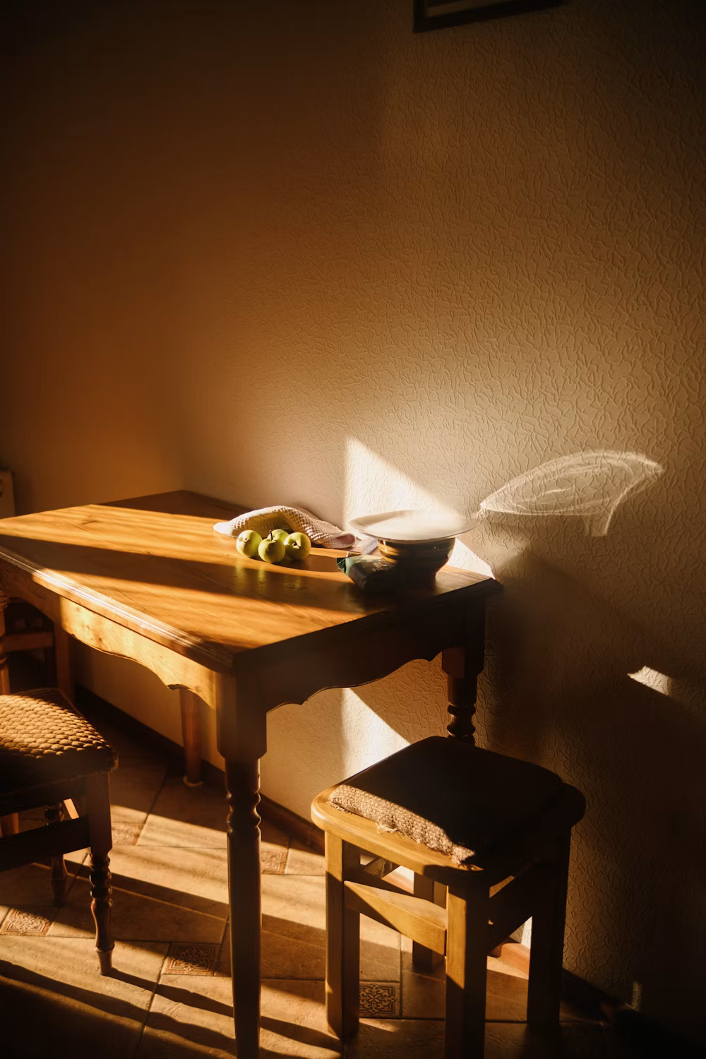 Soft afternoon sunlight on a wooden table — Vladyslav Tobolenko on Unsplash
